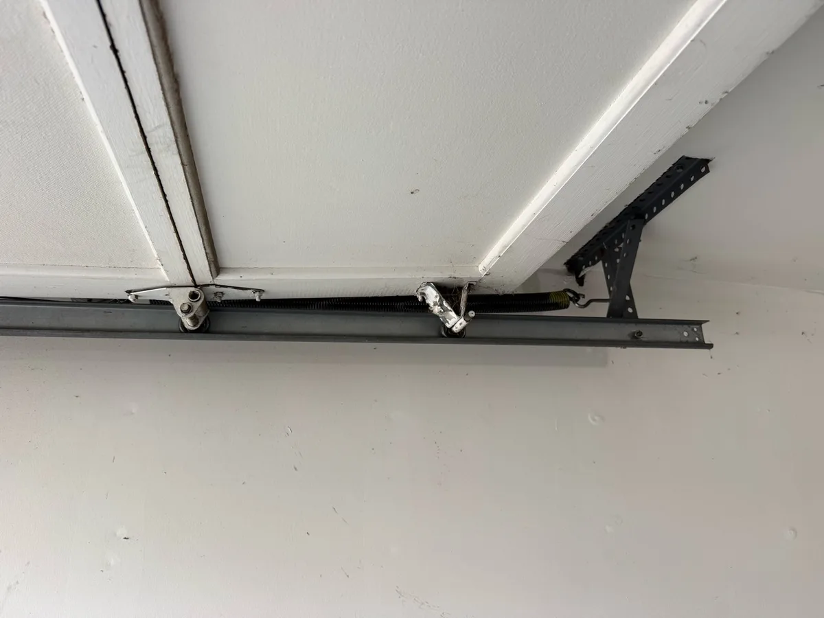 Extension spring garage door repair in Totowa NJ by Literally Garage Door