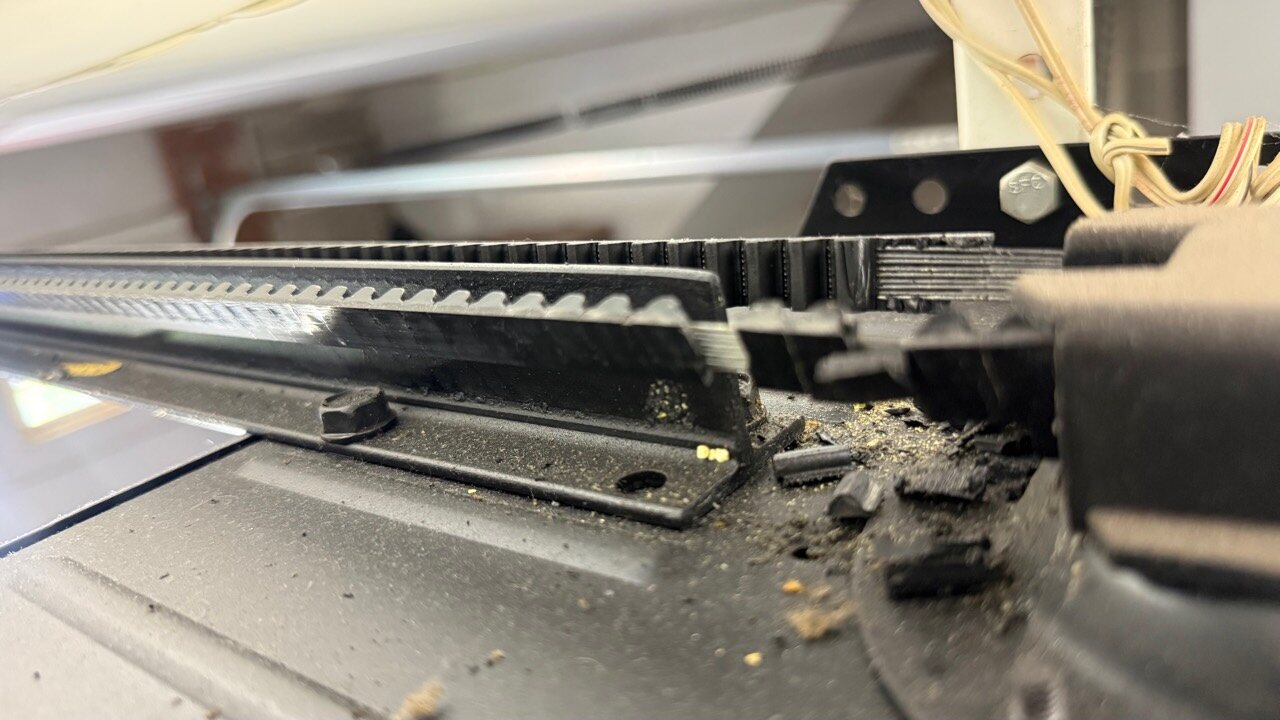 Cliffside Park NJ garage door opener drive rail and trolley close-up during repair inspection