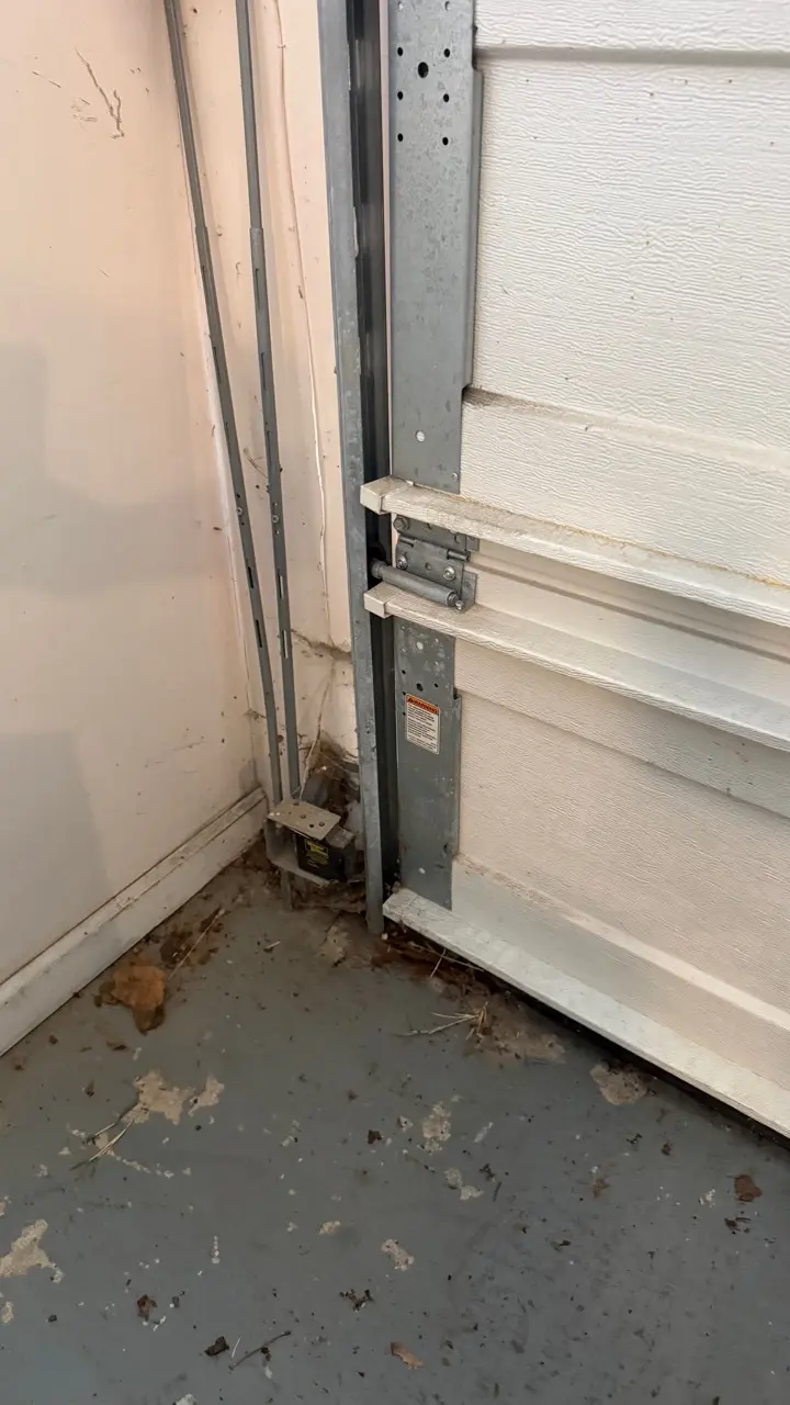 Garage door roller and track inspection during off-track repair in Lodi NJ