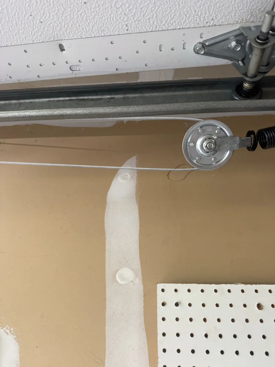 Close-up of the pulley and cable at our West Orange garage door job